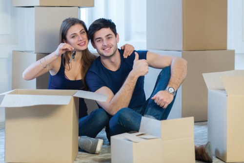 Professional movers loading belongings for a Bow relocation