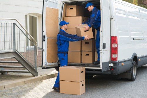 Bow man and van transporting furniture and household items