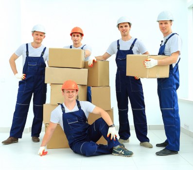 Removal crew loading office boxes and desks for transport
