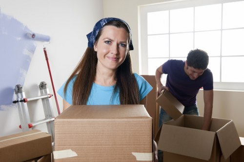 Residential removals in Bow with furniture and boxes prepared for transport