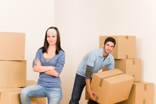 Packing and labelling items for a local business move in Bow