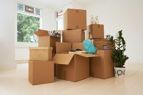 Professional movers preparing items for safe removal in Bow