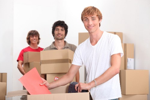 Removal company staff maintaining safe, organised working practices